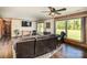 Bright living room featuring large windows, hardwood flooring, and a comfortable seating arrangement at 153 Coachman Loop, Statesville, NC 28625