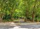 Picturesque community entrance with tree-lined streets and landscaped grounds, offering a serene setting at 1596 Clayton Dr, Charlotte, NC 28203