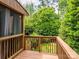 Wooden deck overlooking a lush, tree-lined backyard, perfect for outdoor relaxation at 1596 Clayton Dr, Charlotte, NC 28203