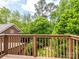Inviting deck offers wooded views and a relaxing outdoor space, perfect for enjoying nature at 1596 Clayton Dr, Charlotte, NC 28203