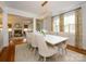 Chic dining room with stylish lighting, neutral color palette, and an open view to the living area at 1596 Clayton Dr, Charlotte, NC 28203