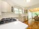 Bright kitchen featuring quartz countertops, stainless steel appliances, and seamless access to the breakfast nook at 1596 Clayton Dr, Charlotte, NC 28203
