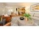 Spacious living room with hardwood floors and an open layout, showcasing stairs and a dining area at 1596 Clayton Dr, Charlotte, NC 28203