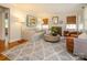 Cozy living room featuring a fireplace, comfortable seating, and a stylish area rug at 1596 Clayton Dr, Charlotte, NC 28203