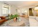 Bright living room with hardwood floors, stylish furniture, and an open view into the dining area at 1596 Clayton Dr, Charlotte, NC 28203