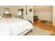 Comfortable main bedroom includes a king bed, wood floors and an ensuite bath and dressing area at 1596 Clayton Dr, Charlotte, NC 28203