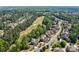 Gorgeous aerial of neighborhood with community golf course and lush green surroundings at 16519 Flintrock Falls Ln, Charlotte, NC 28278