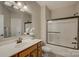 Bathroom featuring a single sink vanity and tiled shower and tub combo at 16519 Flintrock Falls Ln, Charlotte, NC 28278