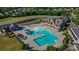 Bird's eye view of community pool and surrounding amenities, creating an inviting and recreational space at 16519 Flintrock Falls Ln, Charlotte, NC 28278