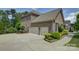 Spacious three-car garage with ample parking and well-maintained landscaping at 16519 Flintrock Falls Ln, Charlotte, NC 28278