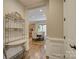 Inviting hallway leading to a dining room and featuring an elegant marble-top console table at 16519 Flintrock Falls Ln, Charlotte, NC 28278