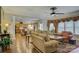 The open-concept living room features hardwood floors, neutral paint, and seamlessly connects to the dining area at 16519 Flintrock Falls Ln, Charlotte, NC 28278