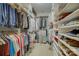 A walk-in closet featuring custom shelving and ample storage space at 16519 Flintrock Falls Ln, Charlotte, NC 28278