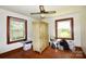 The bedroom has hardwood floors, windows offering light and a great space for relaxing at 17389 Mooresville Rd, Mooresville, NC 28115