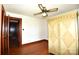 The bedroom has hardwood floors, a ceiling fan, and large closet which provides great storage at 17389 Mooresville Rd, Mooresville, NC 28115