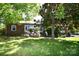 Charming brick home with lush green lawn and mature trees at 17389 Mooresville Rd, Mooresville, NC 28115