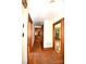 Hallway with hardwood floors, providing access to various rooms in the home at 17389 Mooresville Rd, Mooresville, NC 28115