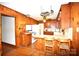 Functional kitchen with wood cabinets, retro appliances, and breakfast bar at 17389 Mooresville Rd, Mooresville, NC 28115