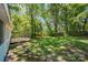 Spacious backyard with deck and mature trees at 1938 Dembrigh Ln, Charlotte, NC 28262