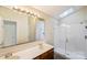 Bathroom features a double sink vanity and a large walk-in shower at 1938 Dembrigh Ln, Charlotte, NC 28262