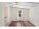 Bright bedroom featuring a window and wood-look flooring at 1938 Dembrigh Ln, Charlotte, NC 28262