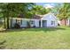 Cozy home showcasing blue siding, dark shutters, and a lovely front yard at 1938 Dembrigh Ln, Charlotte, NC 28262