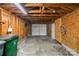 Spacious detached garage with exposed wooden beams, concrete floor, and ample storage space at 1938 Dembrigh Ln, Charlotte, NC 28262
