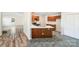Well-lit kitchen showcases wood cabinets, an island, and stainless steel appliances at 1938 Dembrigh Ln, Charlotte, NC 28262