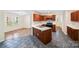 Modern kitchen with dark wood cabinets, stainless appliances, and an open layout at 1938 Dembrigh Ln, Charlotte, NC 28262
