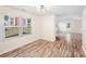 Bright living room features wood floors, natural light from the window and white walls at 1938 Dembrigh Ln, Charlotte, NC 28262