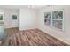 Bright room boasts wood floors, a window with natural light and a nearby doorway at 1938 Dembrigh Ln, Charlotte, NC 28262
