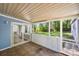 Enclosed patio with brick flooring and views of the backyard at 1938 Dembrigh Ln, Charlotte, NC 28262