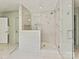 Modern walk-in shower featuring marble-tiled walls, glass door, and contemporary fixtures at 2018 Radcliffe Ave, Charlotte, NC 28207