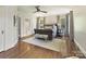 Spacious bedroom with hardwood floors, a comfortable bed, and plenty of natural light at 2018 Radcliffe Ave, Charlotte, NC 28207