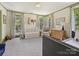 Charming Bedroom featuring a crib, changing table, and windows with patterned curtains at 2018 Radcliffe Ave, Charlotte, NC 28207