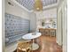 Charming breakfast nook featuring a custom banquette, whimsical ceiling, and seamless flow into a modern kitchen at 2018 Radcliffe Ave, Charlotte, NC 28207