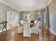 Elegant dining room with patterned wallpaper, hardwood floors, and stylish chandelier at 2018 Radcliffe Ave, Charlotte, NC 28207