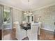 Stylish dining room with patterned wallpaper, hardwood floors, and modern chandelier at 2018 Radcliffe Ave, Charlotte, NC 28207