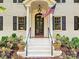 Inviting front entrance with a black door, American flag, and decorative planters at 2018 Radcliffe Ave, Charlotte, NC 28207