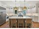 Stunning kitchen featuring gray cabinets, a spacious island, and stainless steel appliances at 2018 Radcliffe Ave, Charlotte, NC 28207