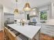 Modern kitchen featuring gray cabinets, stainless steel appliances, and a spacious island with seating at 2018 Radcliffe Ave, Charlotte, NC 28207
