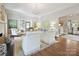 Open-concept living room with hardwood floors, a fireplace, and plenty of seating at 2018 Radcliffe Ave, Charlotte, NC 28207