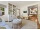 Spacious living room with a charming nook and seamless access to the breakfast area and modern kitchen at 2018 Radcliffe Ave, Charlotte, NC 28207