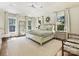Serene main bedroom boasting lots of natural light, neutral tones, and stylish furnishings at 2018 Radcliffe Ave, Charlotte, NC 28207