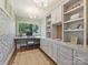 Charming home office with custom built-ins, desk, and a view of the outdoors at 2018 Radcliffe Ave, Charlotte, NC 28207