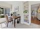 Bright home office featuring a built-in bookshelf, desk, and ample natural light from the window at 2018 Radcliffe Ave, Charlotte, NC 28207