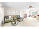 Spacious bonus room with plush sofa, ceiling fan, and plenty of room for activities or storage at 2036 E Foxwood Ct, Indian Land, SC 29707