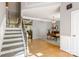Welcoming foyer with staircase, hardwood floors, and open view to the living room at 2036 E Foxwood Ct, Indian Land, SC 29707