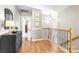 Hallway showcasing hardwood floors and view into another room at 2036 E Foxwood Ct, Indian Land, SC 29707