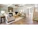 Bright living room featuring tile floors, fireplace, and open layout at 2036 E Foxwood Ct, Indian Land, SC 29707